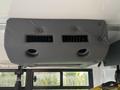 A gray overhead air conditioning unit with two circular vents designed for a 2021 Ford Transit-350
