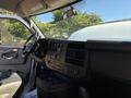 Interior view of a 2019 GMC Savana showing the driver's seat dashboard controls and steering wheel