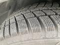 Close-up of a tire with a patterned tread design showing good depth and wear indicating it's suitable for various driving conditions