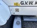 A 2013 International 7500 with a visible fuel filler cap and a warning label that states to use diesel fuel only