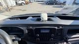 Dashboard of a 2021 Ford Transit showing the center console with a display screen and various control buttons