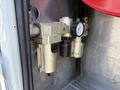 A close-up view of a fuel filter and regulator system mounted on the side of a 2020 Ram 2500 showing metal components and gauges