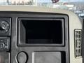 Interior dashboard view of a 2010 International 4300 showing an empty radio slot and various controls