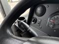 Steering wheel and controls of a 2018 Ford Econoline with turn signal lever and dashboard indicators