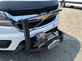 A 2017 Chevrolet Colorado with a winch mounted on the front bumper and a chrome grille featuring the Chevrolet logo