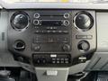 Dashboard of a 2015 Ford F-350 featuring various dials for climate control audio system and control buttons for auxiliary functions