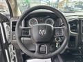 Steering wheel and dashboard of a 2016 RAM 5500 featuring the RAM logo and multiple gauges on the panel