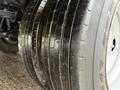 Close-up of the thick tires on a 2012 Ford F-450 SD showcasing the tread pattern and rubber texture