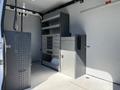 Interior of a 2017 Mercedes-Benz Sprinter with shelves and storage units organized for efficient use of space