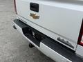 A 2017 Chevrolet Silverado 1500 with a white exterior featuring the Chevrolet emblem and High Country trim badge on the tailgate