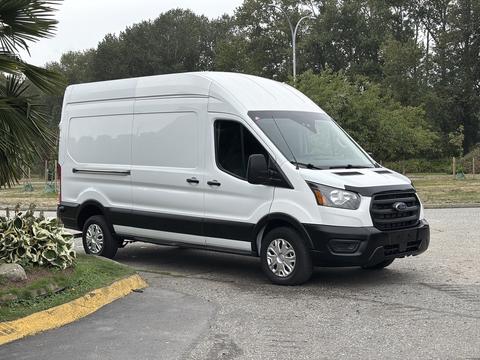 A 2020 Ford Transit 250 van in white with a high roof and side cargo doors facing slightly to the left