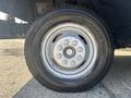 Close-up of a wheel and tire from a 2012 Ford E-450 with the tire brand Duravis and size specifications visible