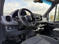 Interior of a 2021 Mercedes-Benz Sprinter showcasing the steering wheel dashboard controls and seating