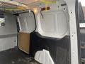 Interior view of a 2017 Ford Transit Connect showing the cargo area with plain walls and flooring designed for transportation and storage purposes