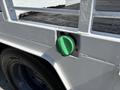 Close-up of a green diesel fuel cap on a 2017 Ford F-550 truck with a white fuel tank compartment