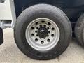 Close-up of a Goodyear G182 RSD tire mounted on a 2013 Freightliner 114SD showcasing tread pattern and metal rim