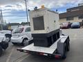 A 2005 Katolight SED60FPJ4 generator mounted on a trailer with a metal body and a grid-patterned vent on the side