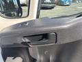Close-up view of the door handle and interior panel of a 2020 RAM ProMaster 3500 showing textured black material and a sleek design