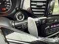 Close-up of the gear shift lever in a 2016 Mitsubishi Outlander showing various settings including front and rear wipers and a button labeled off