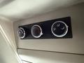 Controls for air conditioning and ventilation in a 2017 Dodge Grand Caravan featuring three circular dials and a sleek panel design