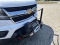 A 2017 Chevrolet Colorado with a winch mounted on the front bumper and a shiny chrome grille featuring the Chevrolet emblem