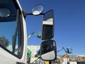 A 2005 Freightliner M2 106 with dual side mirrors reflecting the surroundings