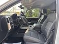 Interior of a 2017 Chevrolet Silverado 1500 featuring a driver's seat and dashboard with controls and a central console