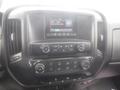 Dashboard of a 2015 Chevrolet Silverado 1500 featuring a touchscreen display radio controls and climate control buttons