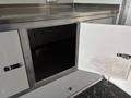 A white metal cabinet with one open door showing an empty interior space