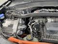 The image shows the engine compartment of a 2021 Ford Explorer with various engine components including hoses wires and a battery