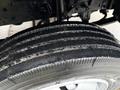 Close-up of a tire on a 2015 Hino 195 showing detailed tread pattern and surface texture