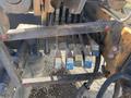 A set of color-coded hydraulic control levers mounted on a metal frame attached to a 2019 Hino 195 vehicle