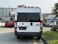 A 2017 RAM Promaster van with a white exterior and large rear doors is parked, showing the brand logo and no visible license plate