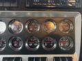 Close-up of the dashboard gauges in a 2018 Kenworth T800 showing various metrics such as axle loads transmission and fuel indicators