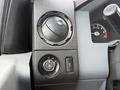Close-up of the dashboard controls in a 2015 Ford F-350 including a dial for temperature and knobs for various settings