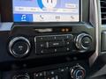 Dashboard controls of a 2019 Ford F-550 featuring audio and airbag indicators with buttons and knobs for volume and media selection
