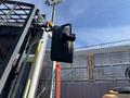 A black mirror attached to the cab of a 2018 Sandvik Ranger DX800 drilling machine