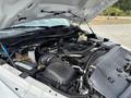 The image shows the engine compartment of a 2016 RAM 5500 with various components including the engine block battery and coolant reservoir