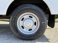 A close-up view of a silver wheel on a 2012 Ford F-350 SD with a black tire featuring the brand name visible on the sidewall