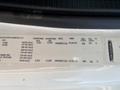 A Freightliner M2 106 specification label detailing axle weights tire sizes and pressure information