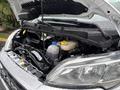 2023 RAM Promaster 3500 engine compartment with various components visible including coolant reservoir and engine parts
