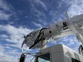 A 2008 Kenworth T370 bucket truck with an elevated aerial work platform and various equipment attached to its boom