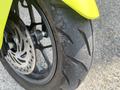 Close-up of a front tire of a 2018 Honda Grom showcasing its tread pattern and rim design