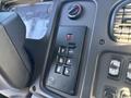 The interior dashboard of a 2005 Freightliner M2 106 showing gear shift controls including buttons for drive reverse and mode