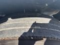 Close-up of a tire on a 2014 Freightliner M2 106 showing tread patterns and wear on the rubber surface