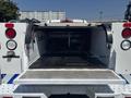 A 2017 Chevrolet Colorado with an open truck bed featuring a diamond plate floor and rear lights