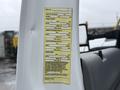 A 2012 Ford F-450 SD featuring a vehicle information label with specifications for weight and tire pressure mounted inside the cab