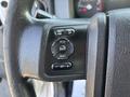 Steering wheel controls of a 2018 Ford F-750 including buttons for cruise control information and settings