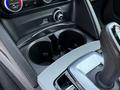 Cup holders and gear shift of a 2020 Alfa Romeo Stelvio