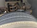 Close-up of a tire on a 2016 RAM 5500 showing tread pattern and suspension components in the background